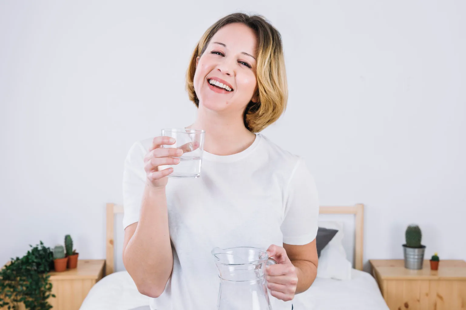 cheerful-woman-with-water-bedroom